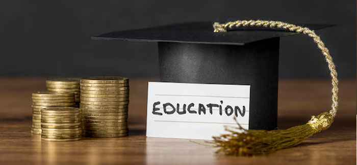 gold coins adjacent to graduation robe hat