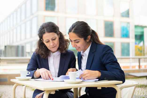 A female counselor is guiding a female student in pursuing an MBA in Ireland